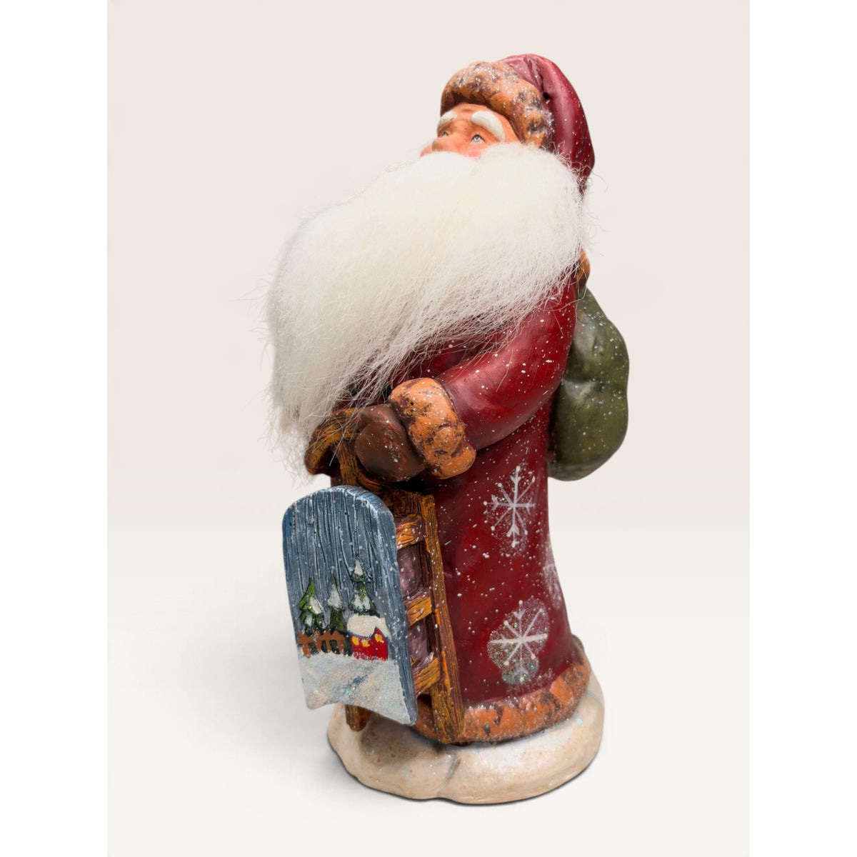 Home for the Holidays 10 Inch Folk Art Santa Figurine with Sled