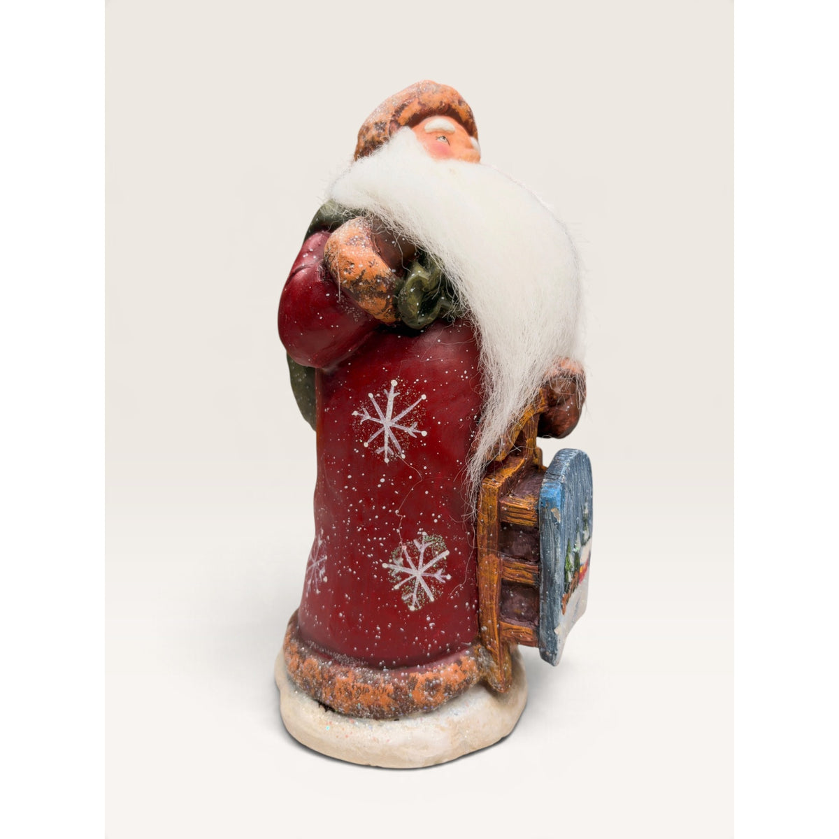 Home for the Holidays 10 Inch Folk Art Santa Figurine with Sled