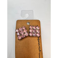 silver tone prong set pink crystal pierced post earrings