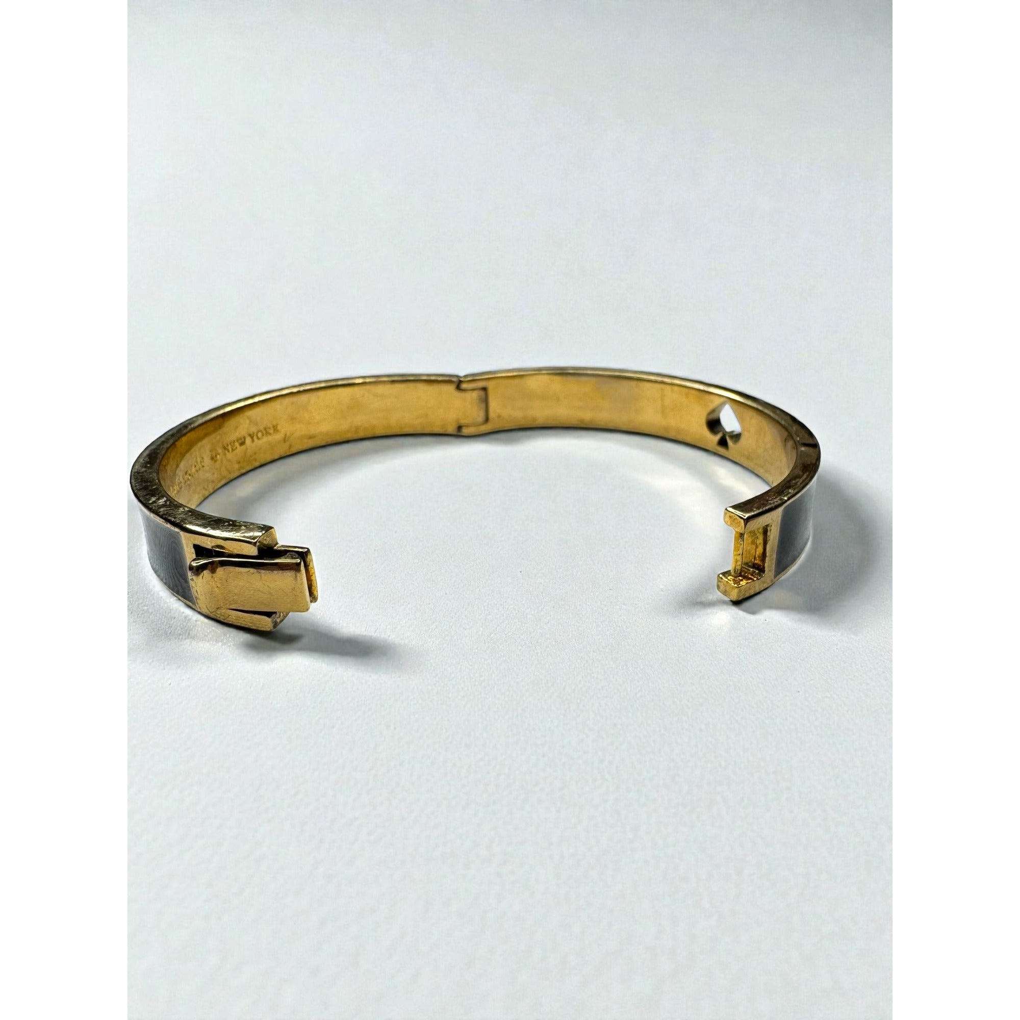 Kate Spade New York Black Enamel Spade Logo Gold Tone Hinged Bangle Bracelet