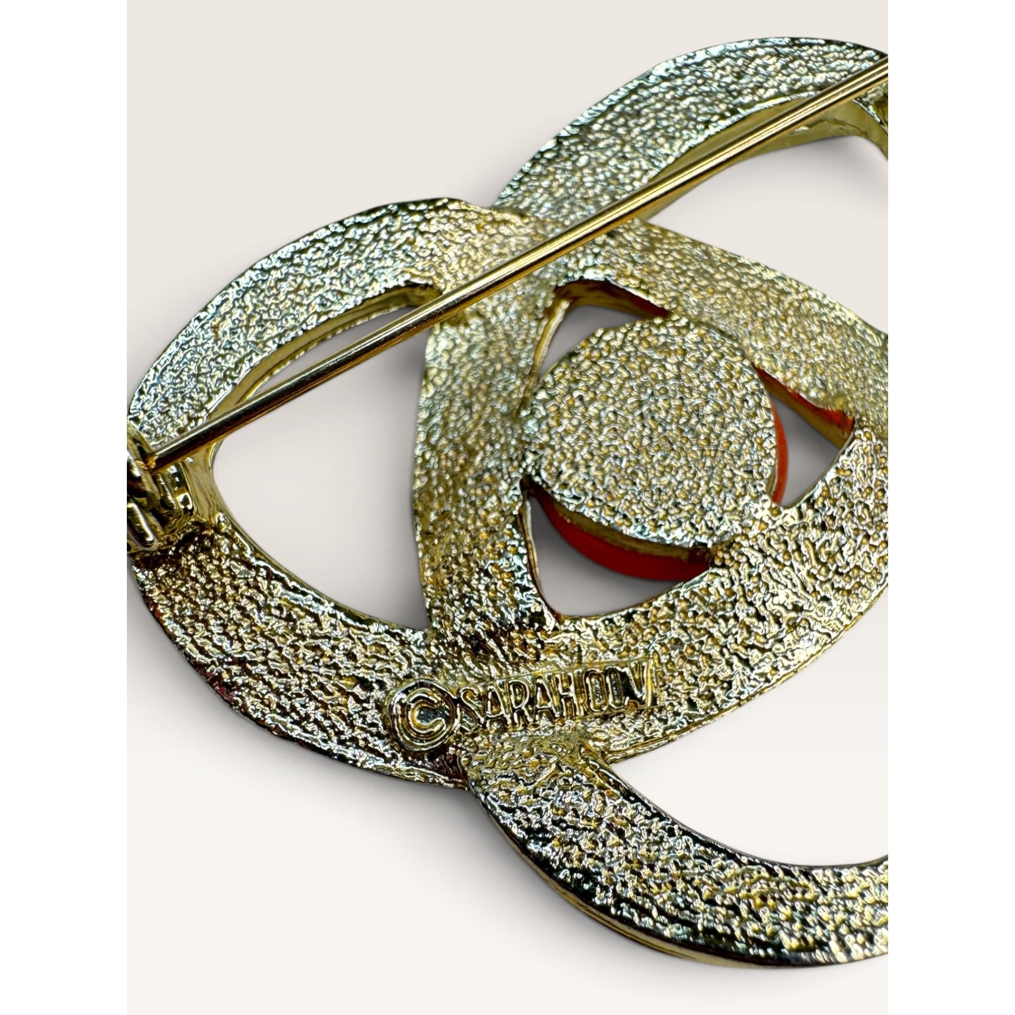 Sarah Coventry 1970s Gold Tone Orange Acrylic Atomic Orbit Swirl Brooch 1.79"
